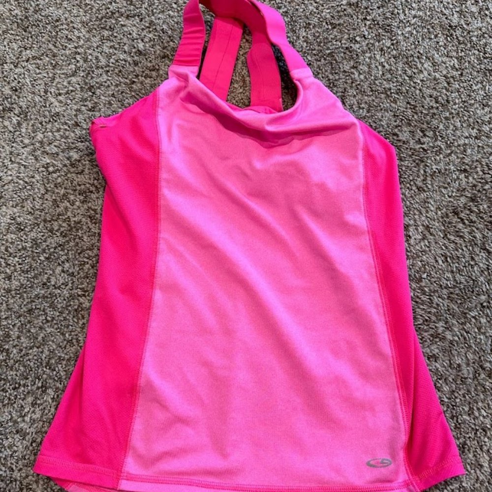 Closet Clean Out. Pink exercise shirt with shelf. Great condition. Rarely used s